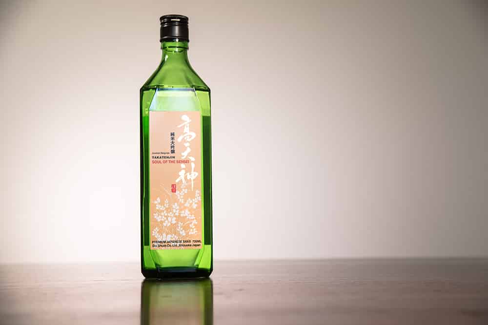 a green bottle of sake