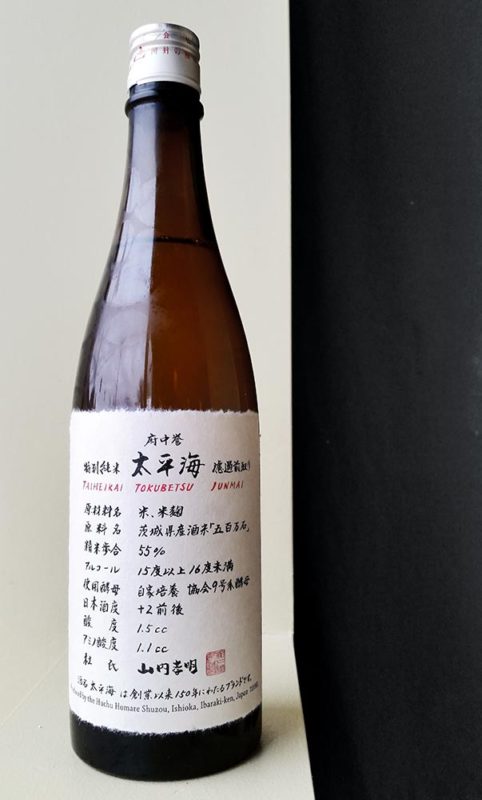 A bottle of Taiheikai sake on a shelf.