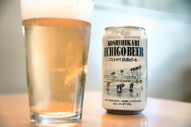A can of Echigo Japanese beer on a full pint glass.