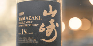 a label of Japanese whisky in a well-lit izakaya