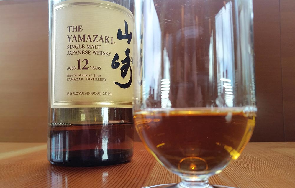 A bottle of the Yamazaki single malt and a Riedel tasting glass.