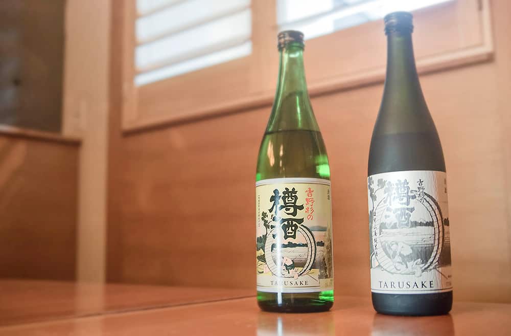 two bottles of cedar-aged sake