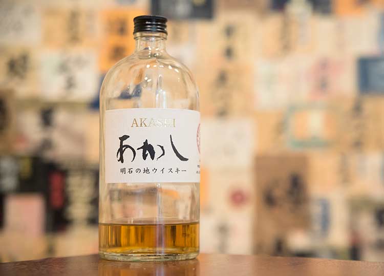 a bottle of Japanese whisky in a colorful room