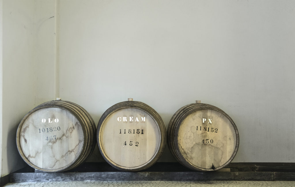 three wooden barrels for aging whisky