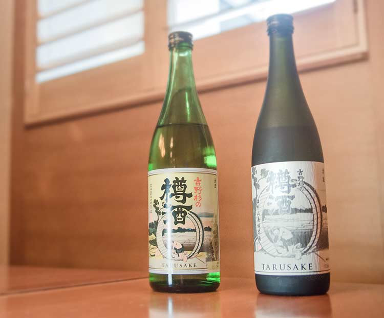 two bottles of cedar-aged sake