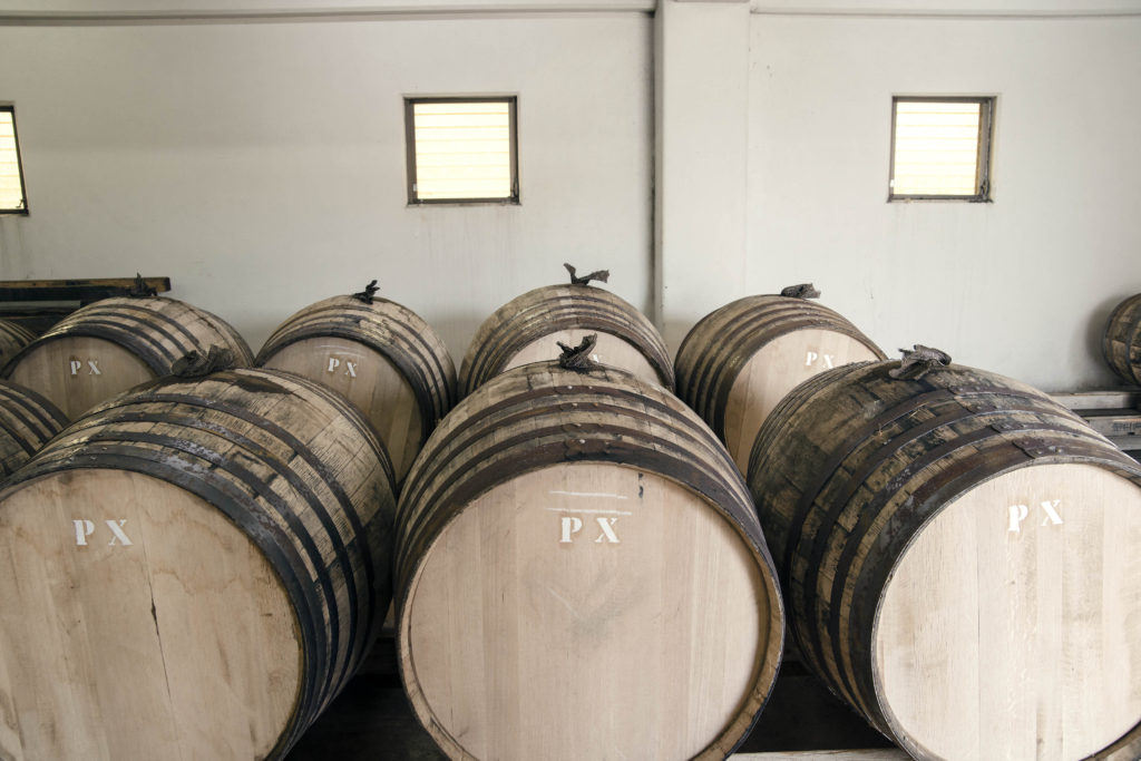 barrels of whisky in rows