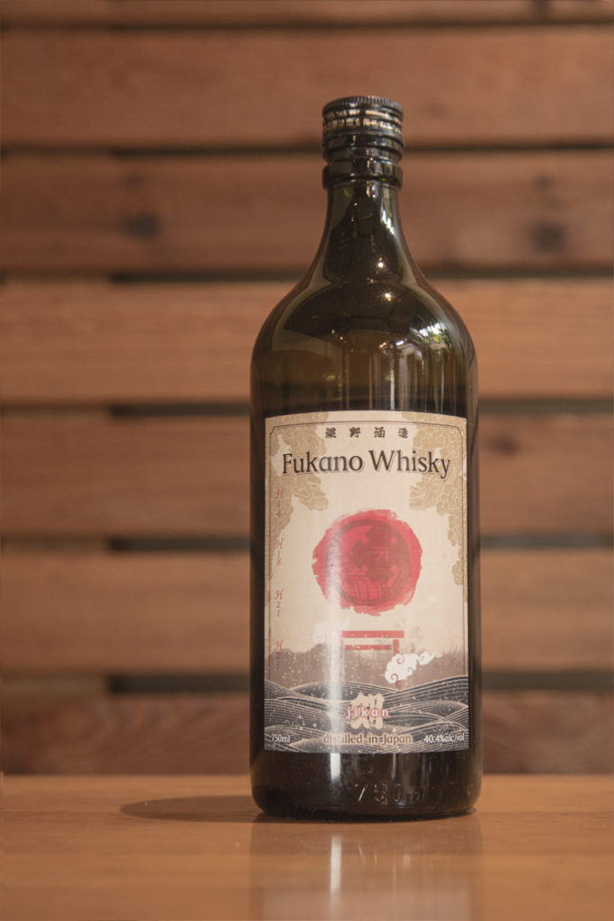 a bottle of Fukano Jikan whisky in a wooden room
