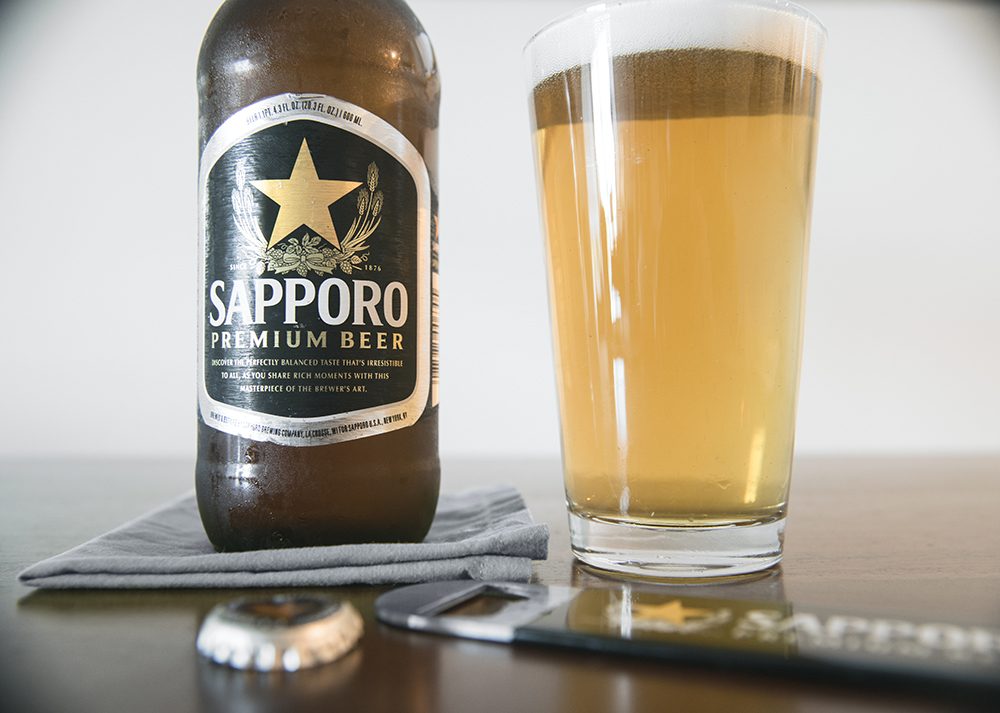 a pint of Sapporo beer and its bottle