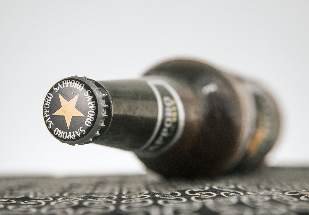 a cap of Sapporo beer with its North Star icon