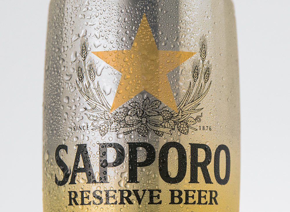 a closeup of a cold can of Sapporo beer