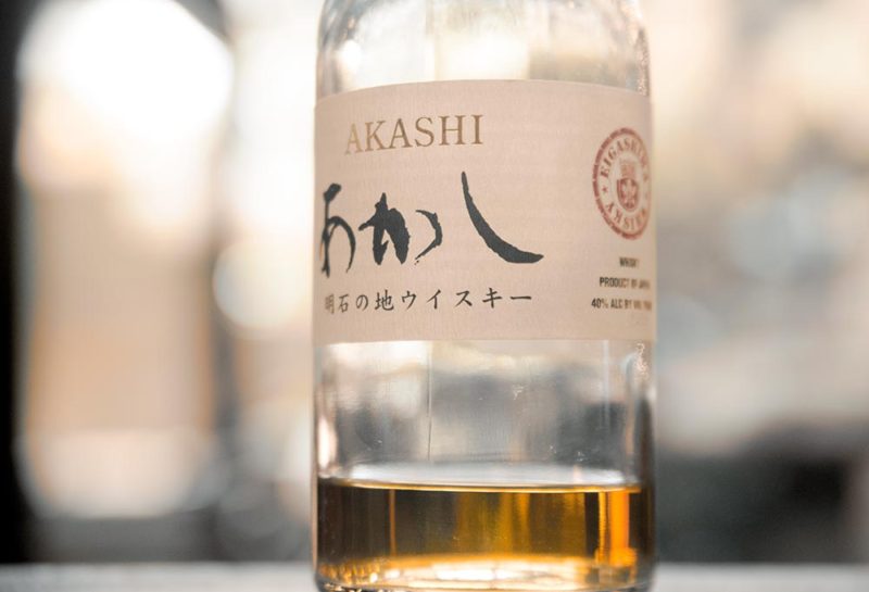 A Japanese whiskey bottle that's almost empty.