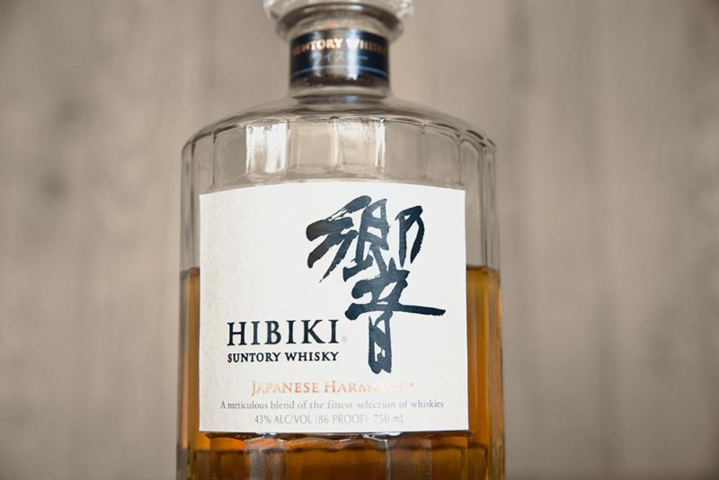 a bottle of Japanese whiskey in a wooden room