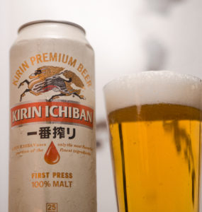 A can of Kirin beer and a full pint glass.