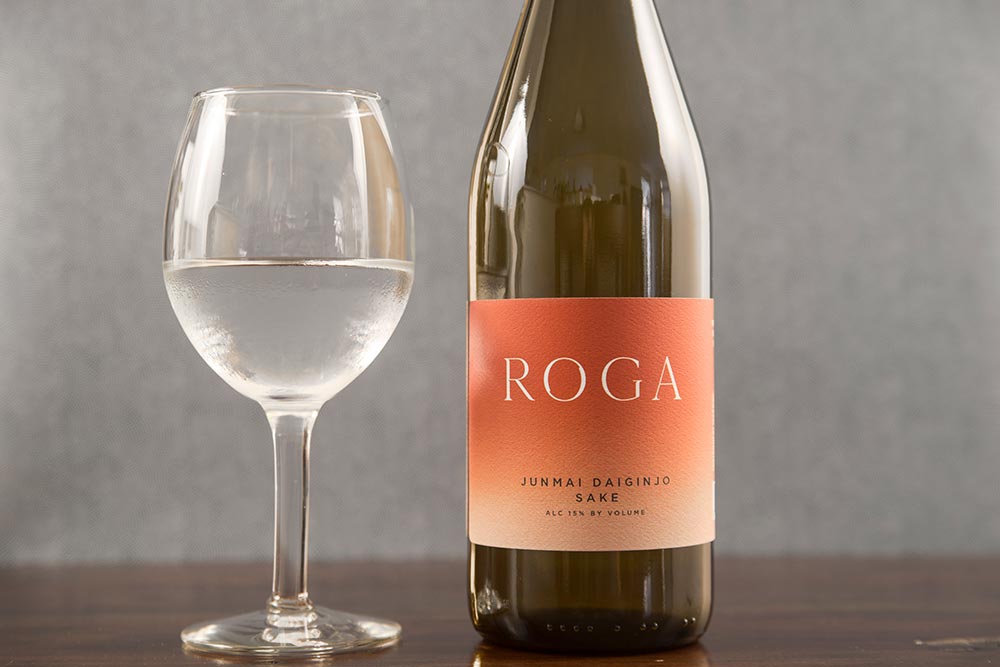 A bottle of Roga Junmai Daiginjo and a wine glass.