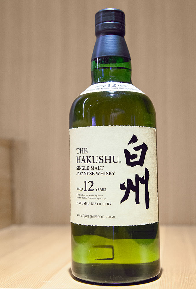 A green and yellow bottle of Japanese whiskey.