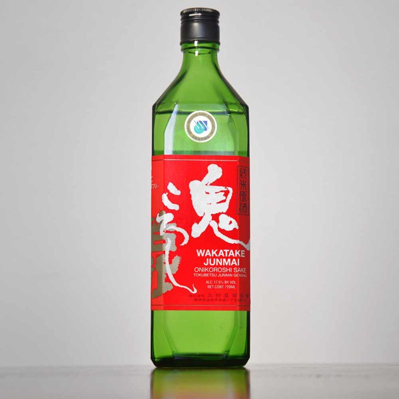 A red and green bottle of Demon Slayer sake.