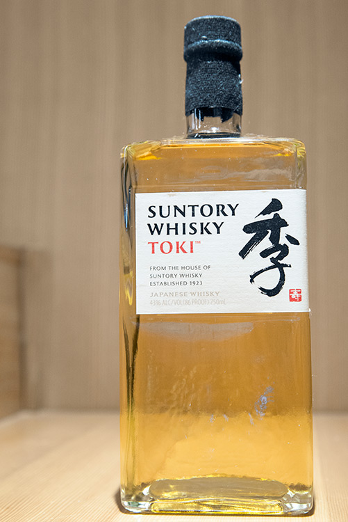 a square bottle of Suntory whiskey