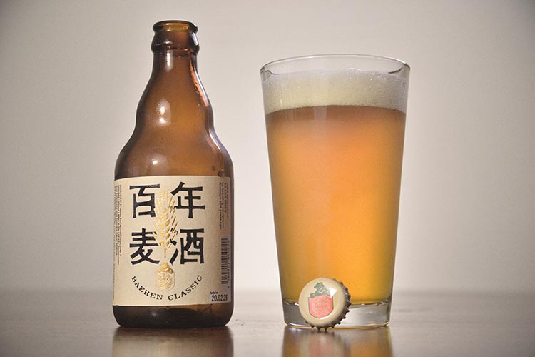 a bottle of Japanese craft beer on a wooden table