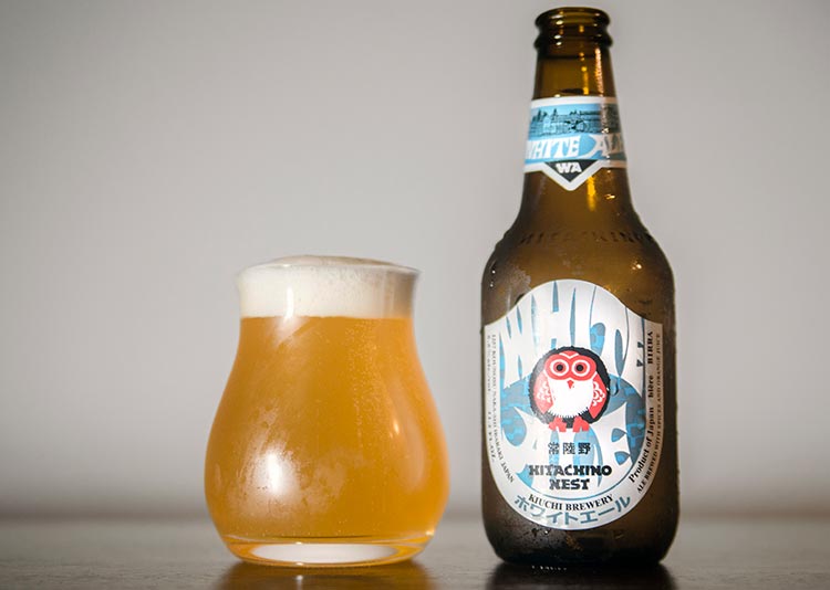 a bottle and glass of Belgian-style Japanese beer