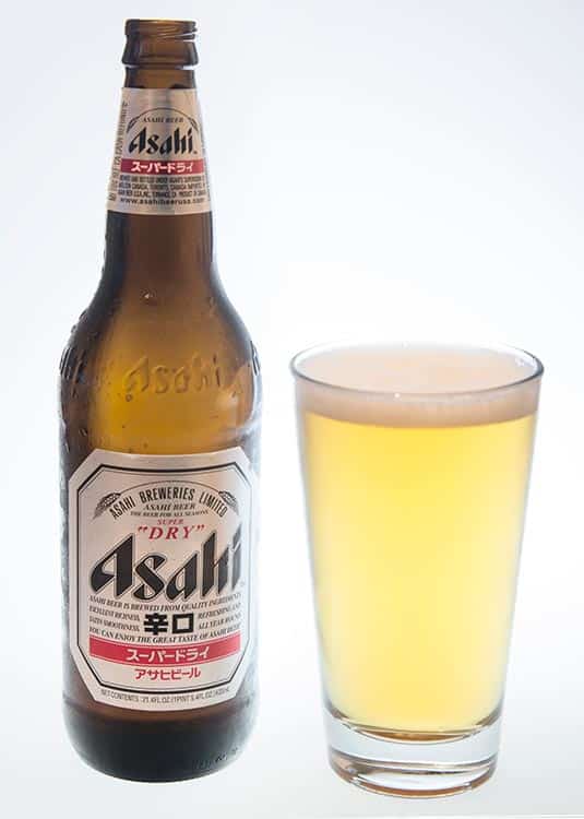 bottle and full pint of Asahi Super Dry