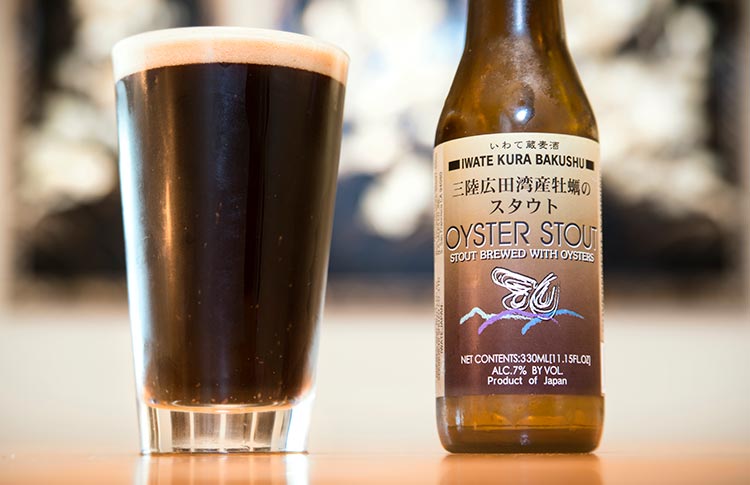 a bottle of oyster stout and a dark, full pint