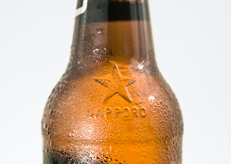 Sapporo North Star beer brand embossed on a glass bottle