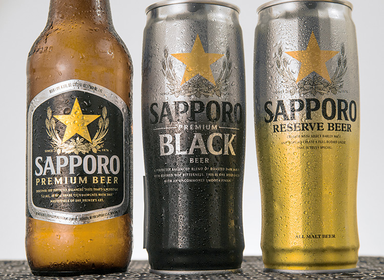 two cans and a bottle of Sapporo beer