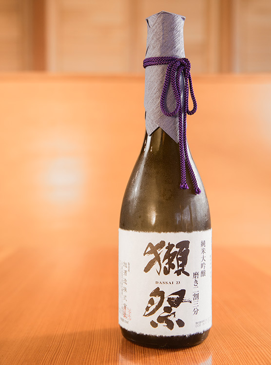 a bottle of high-end Dassai sake in a kappo-style Japanese restaurant