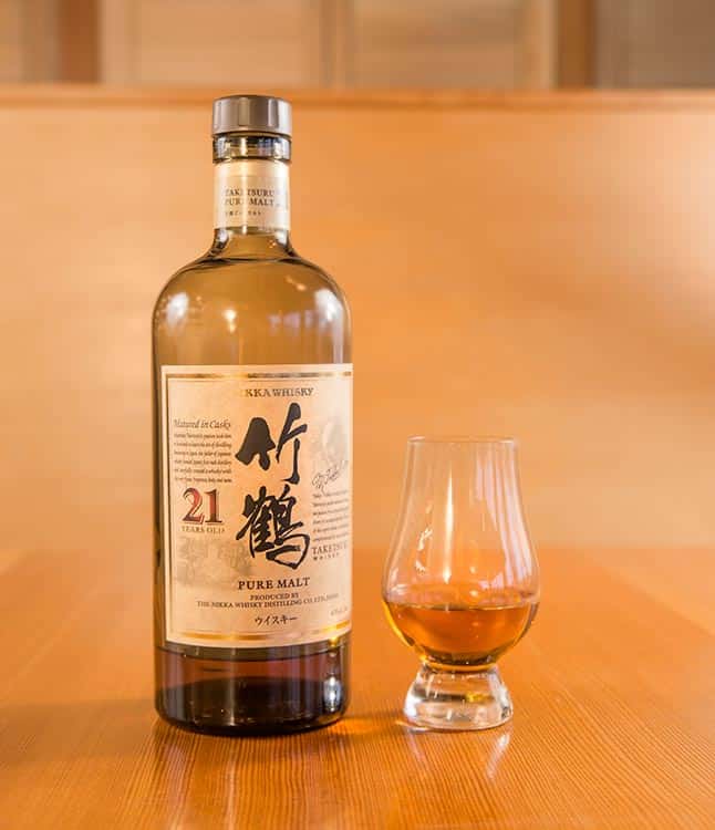 a bottle of pure malt Japanese whisky and a professional tasting glass