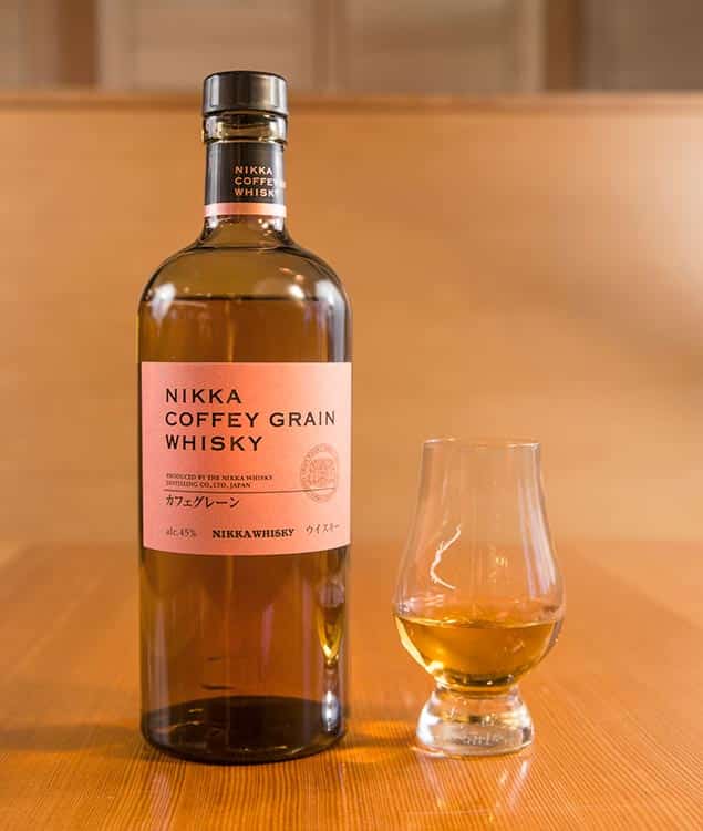 A bottle of Nikka Whiskey and a Glencairn glass