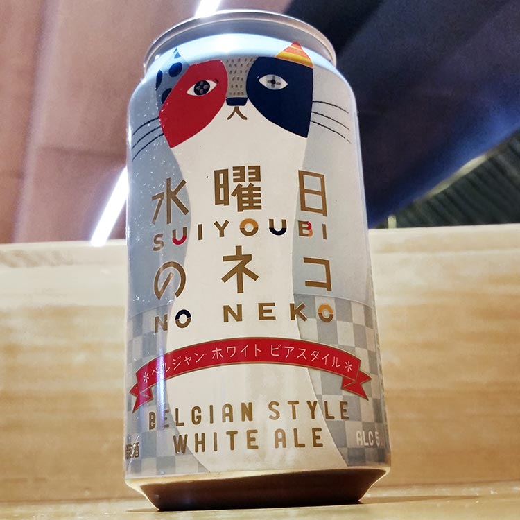 a can of Japanese beer with a cat on the label