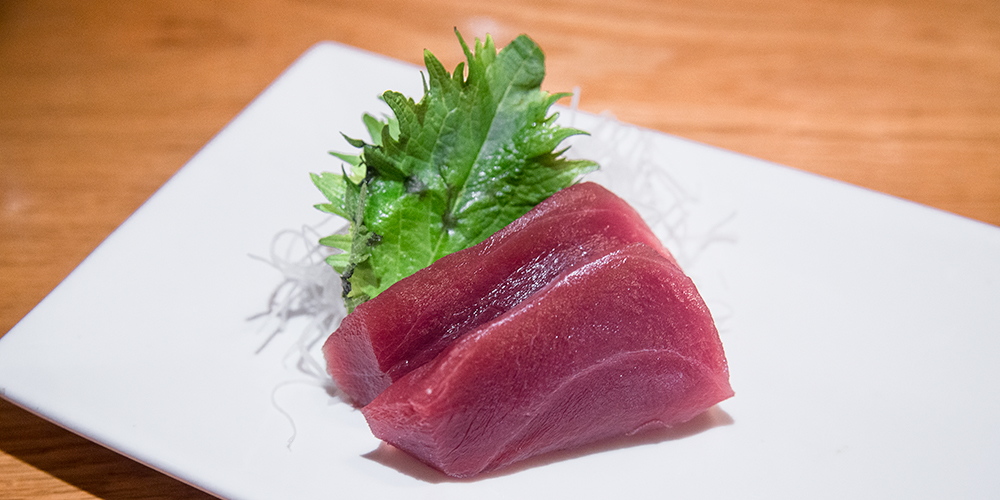 two slices of bluefin tuna sashimi