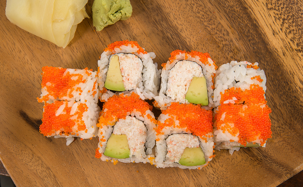 a sushi roll with fish roe