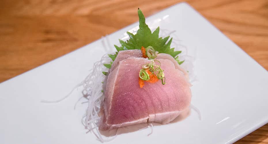 two slices of shiro maguro sashimi