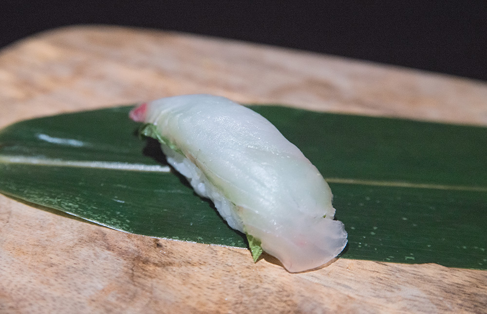 a piece of hirame sushi