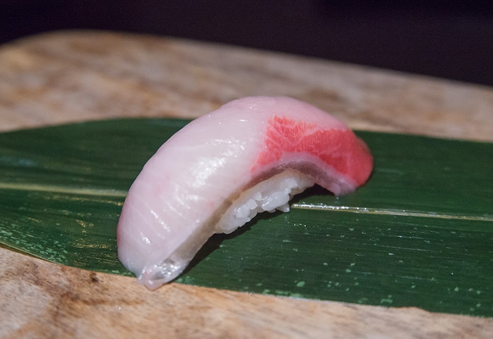 a piece of hamachi nigiri sushi