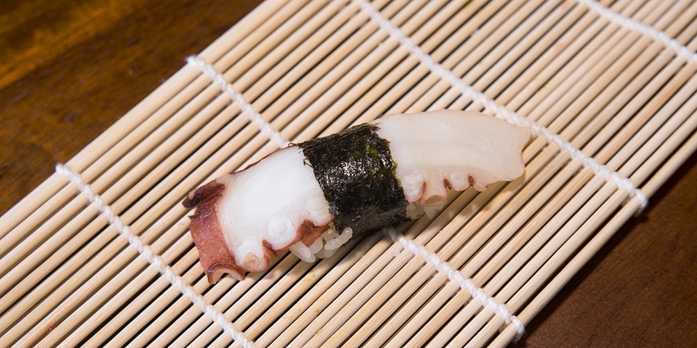 a piece of octopus sushi