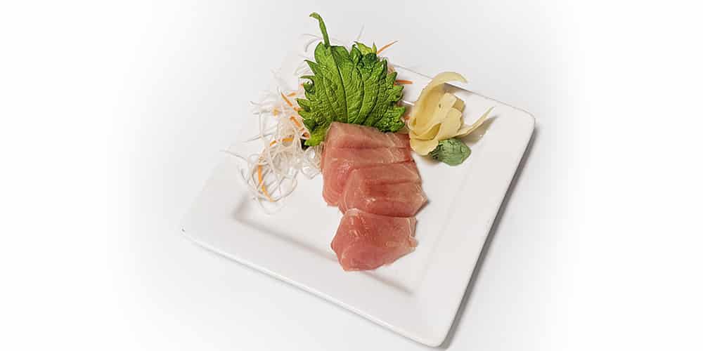 five slices of albacore sashimi