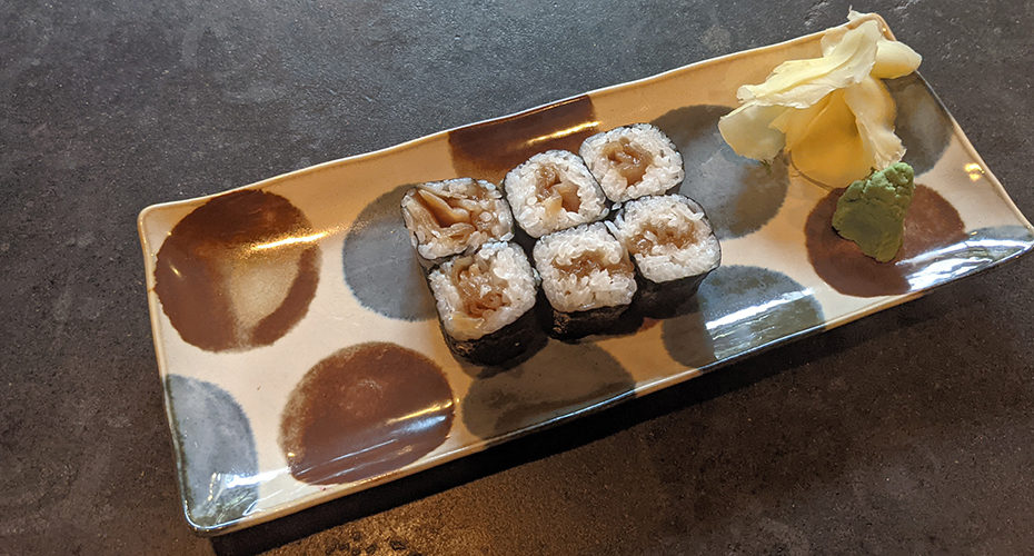 a kanpyo roll on a colorful Japanese plate
