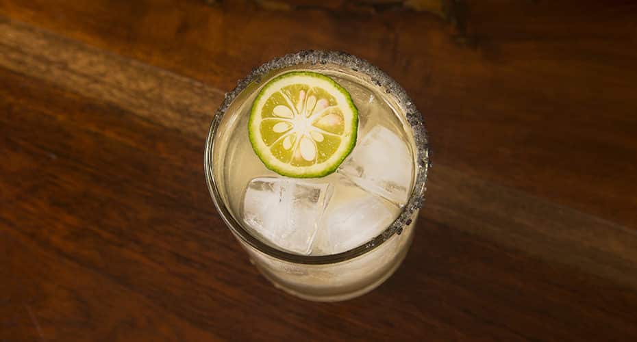 a sweet potato shochu margarita with a yuzu slice