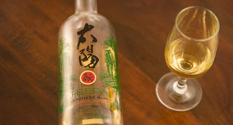 a bottle of Okinawan rum and a tasting glass