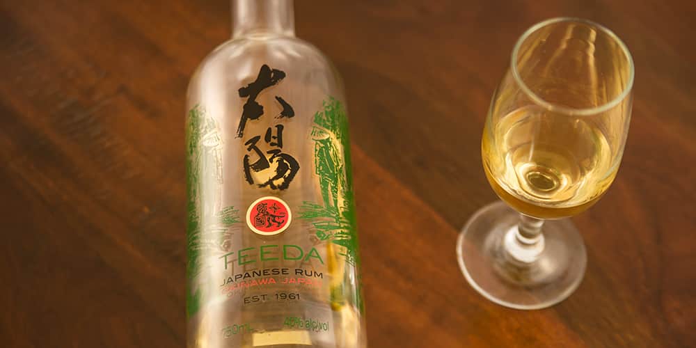 a bottle of Okinawan rum and a tasting glass