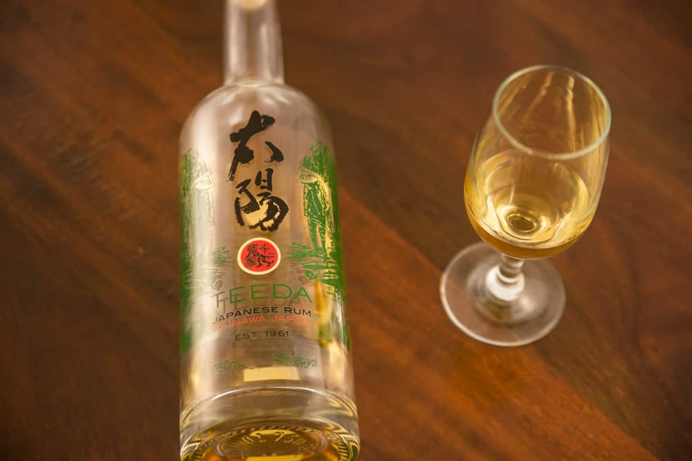 a bottle of Japanese rum and a glass