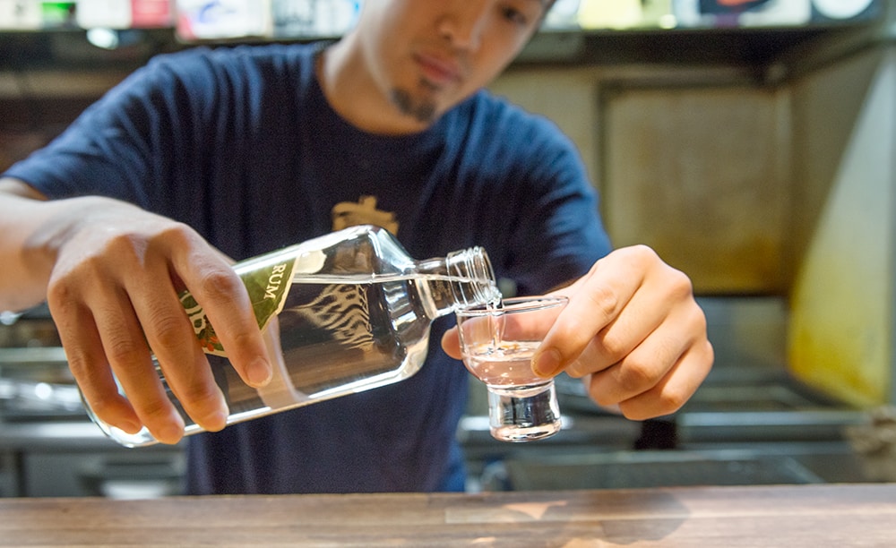 pouring Japanese rum