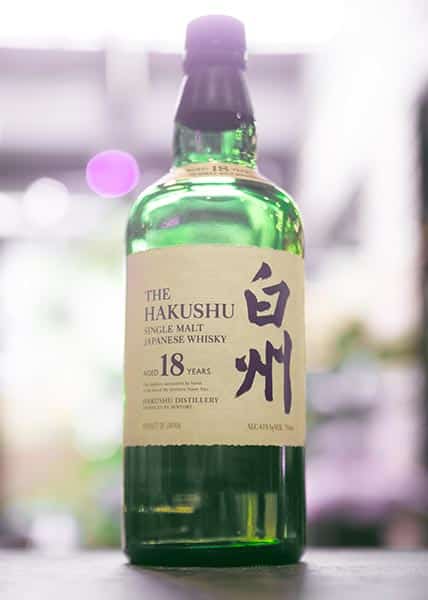 a green bottle of expensive Japanese whisky