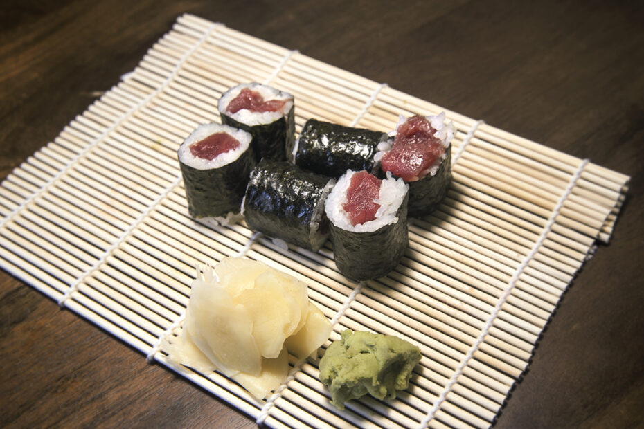 tuna sushi roll on a bamboo mat