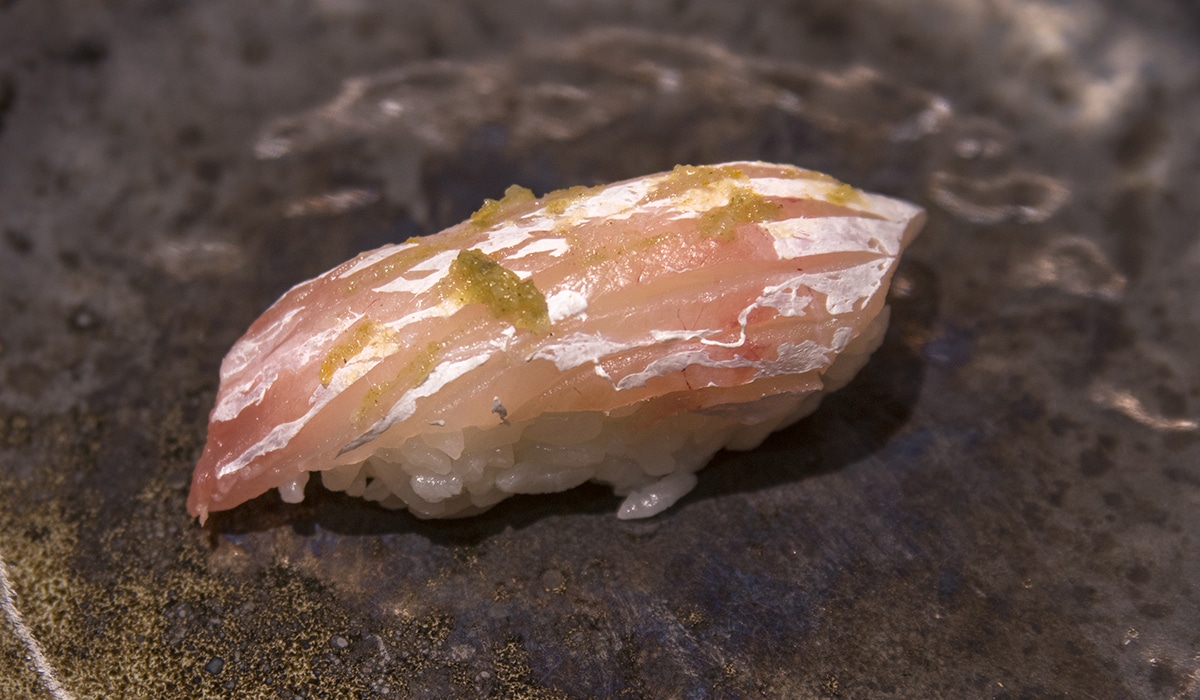 sea bream sushi with yuzu kosho paste on top
