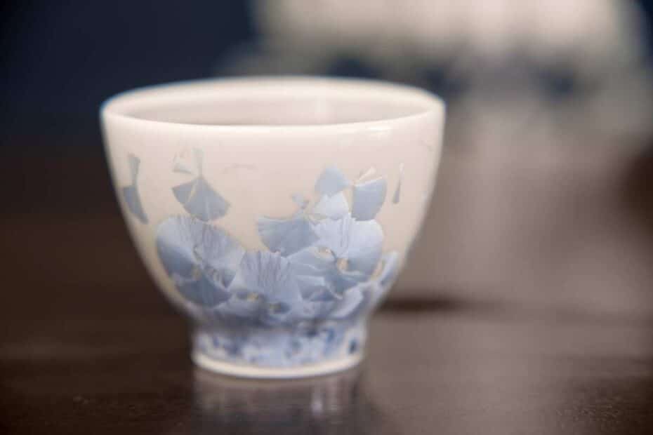 a tan and blue sake cup